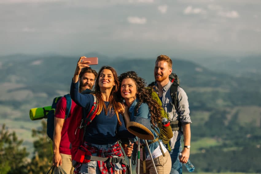 Group of friends taking a selfie in the mountains