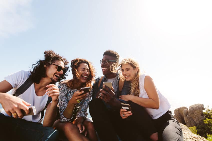 group of friends on their cellphones