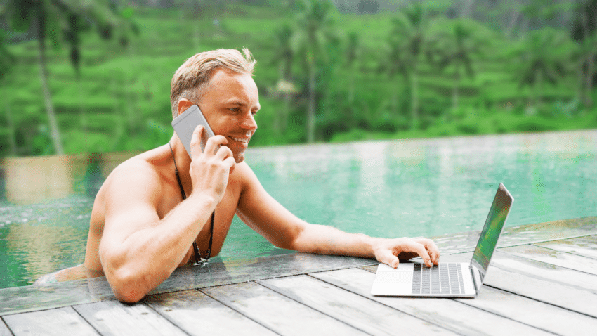 Man taking phone calls while in a pool