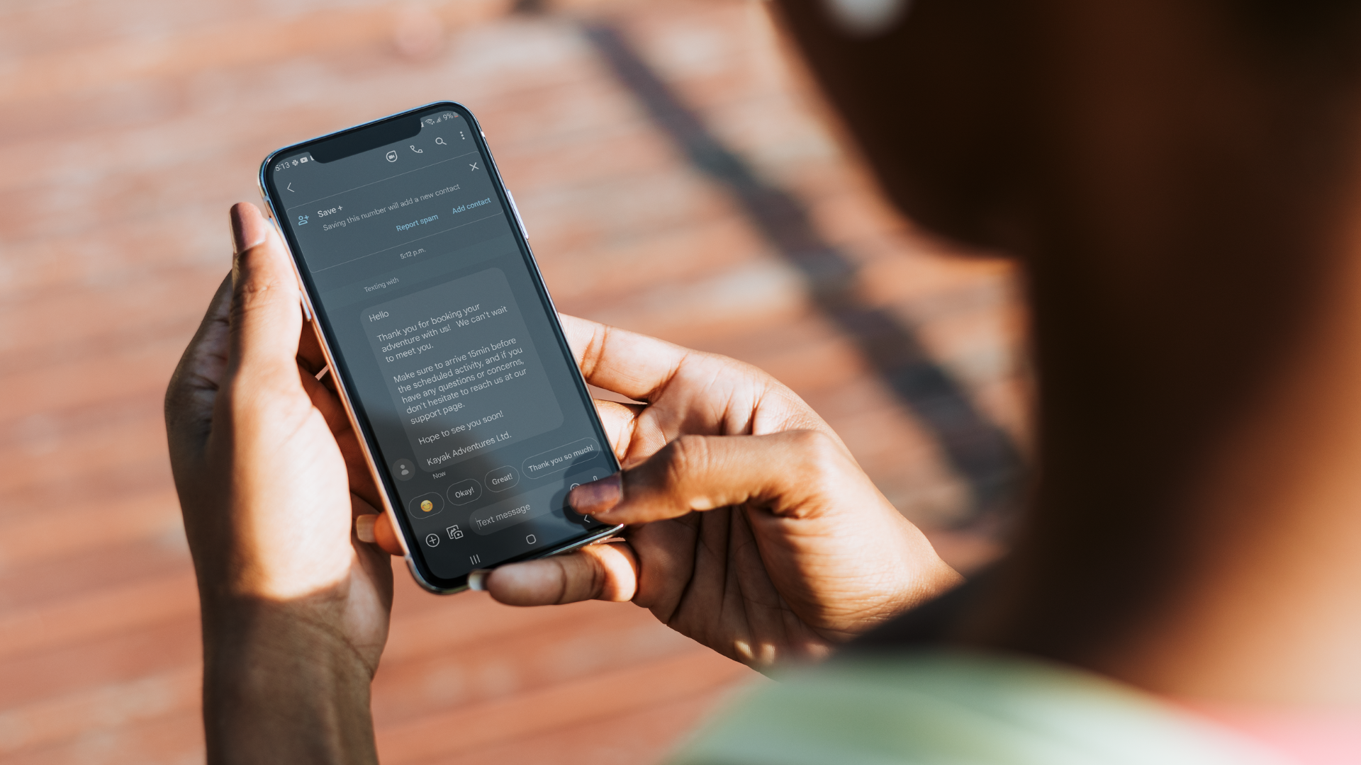 person looking at cellphone SMS