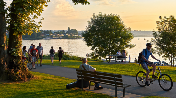locals walking and biking through park
